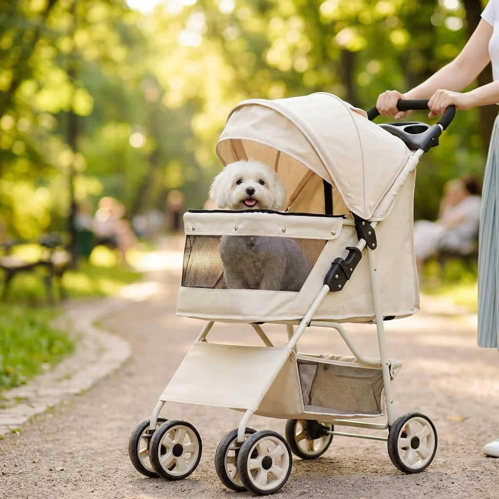PawVibes™ Pastel Foldable Pet Stroller - Bichon Frise enjoying a park walk in cream stroller